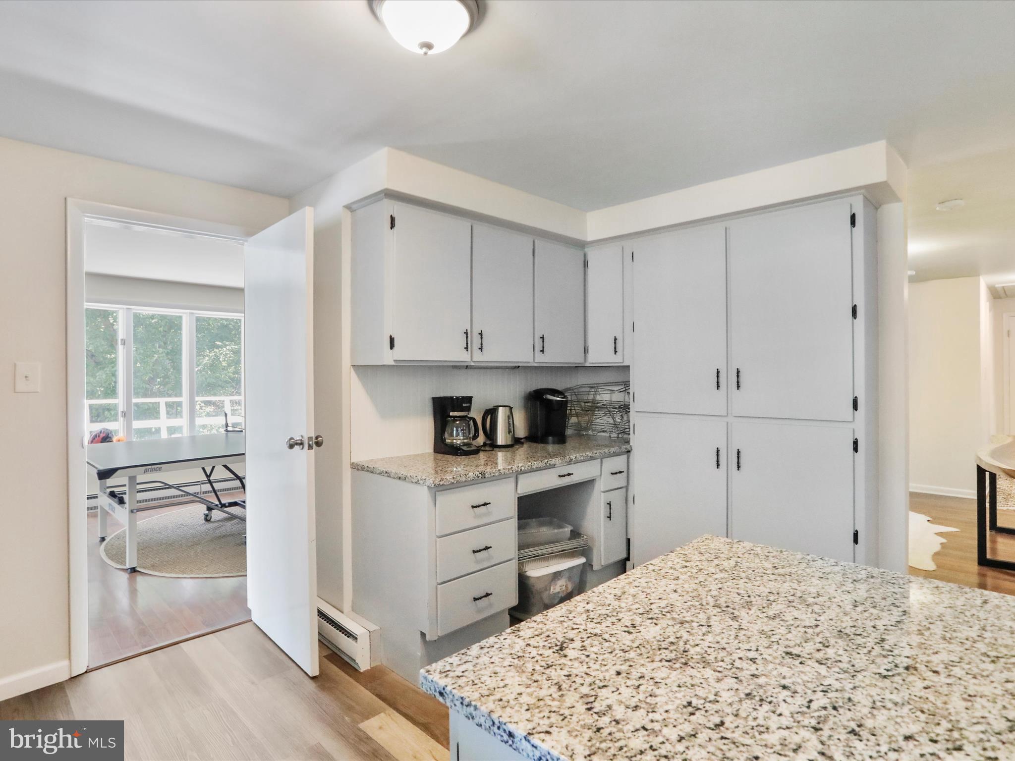 999 Aspero Lane Falling Waters, WV 25419 - Photo 22 of 57 a kitchen with stainless steel appliances granite countertop a stove and a refrigerator