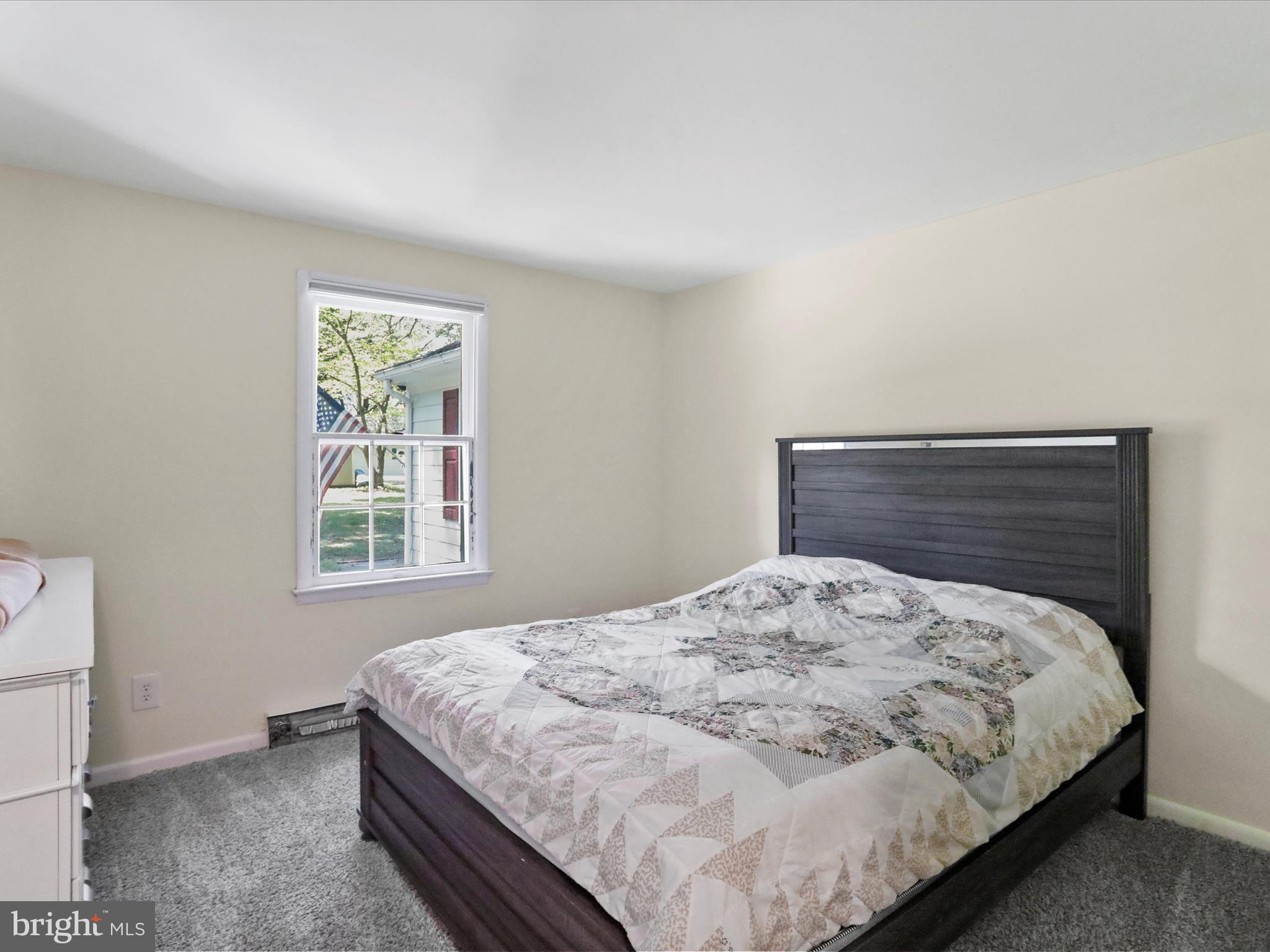 999 Aspero Lane Falling Waters, WV 25419 - Photo 32 of 57 a bedroom with a bed and a window