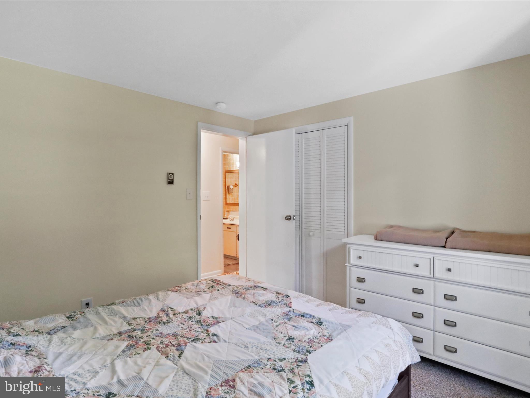 999 Aspero Lane Falling Waters, WV 25419 - Photo 33 of 57 a bedroom with a bed and a dresser