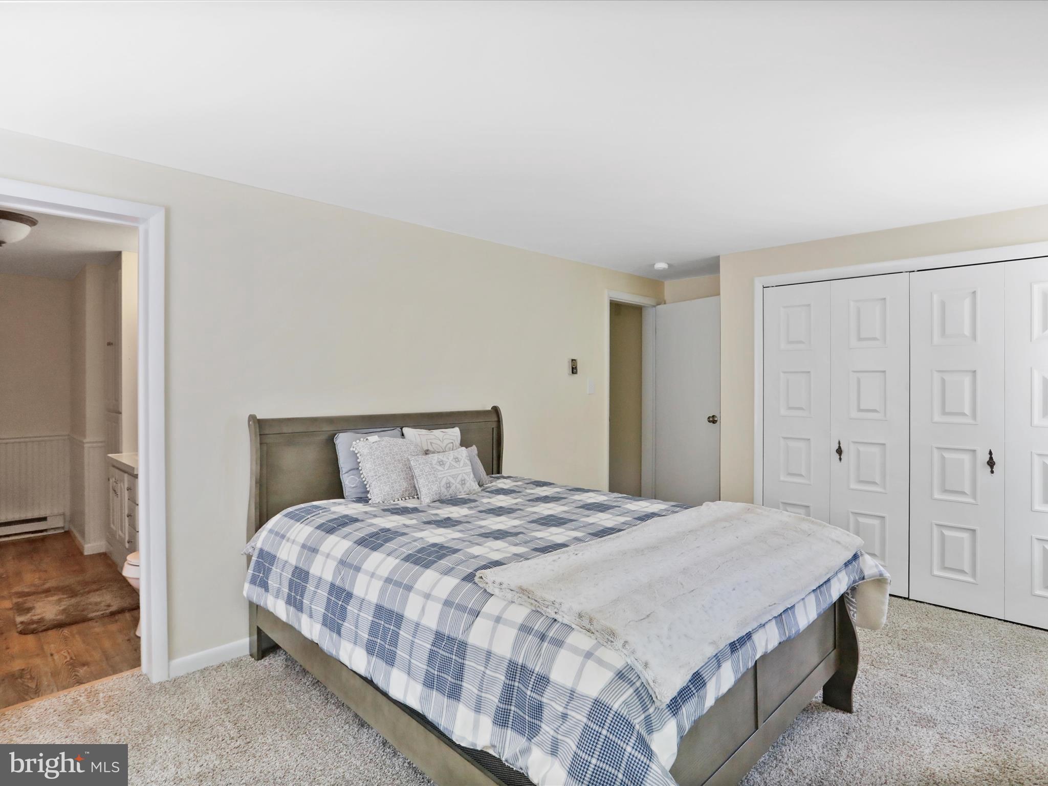 999 Aspero Lane Falling Waters, WV 25419 - Photo 38 of 57 a bedroom with a bed and a cabinets