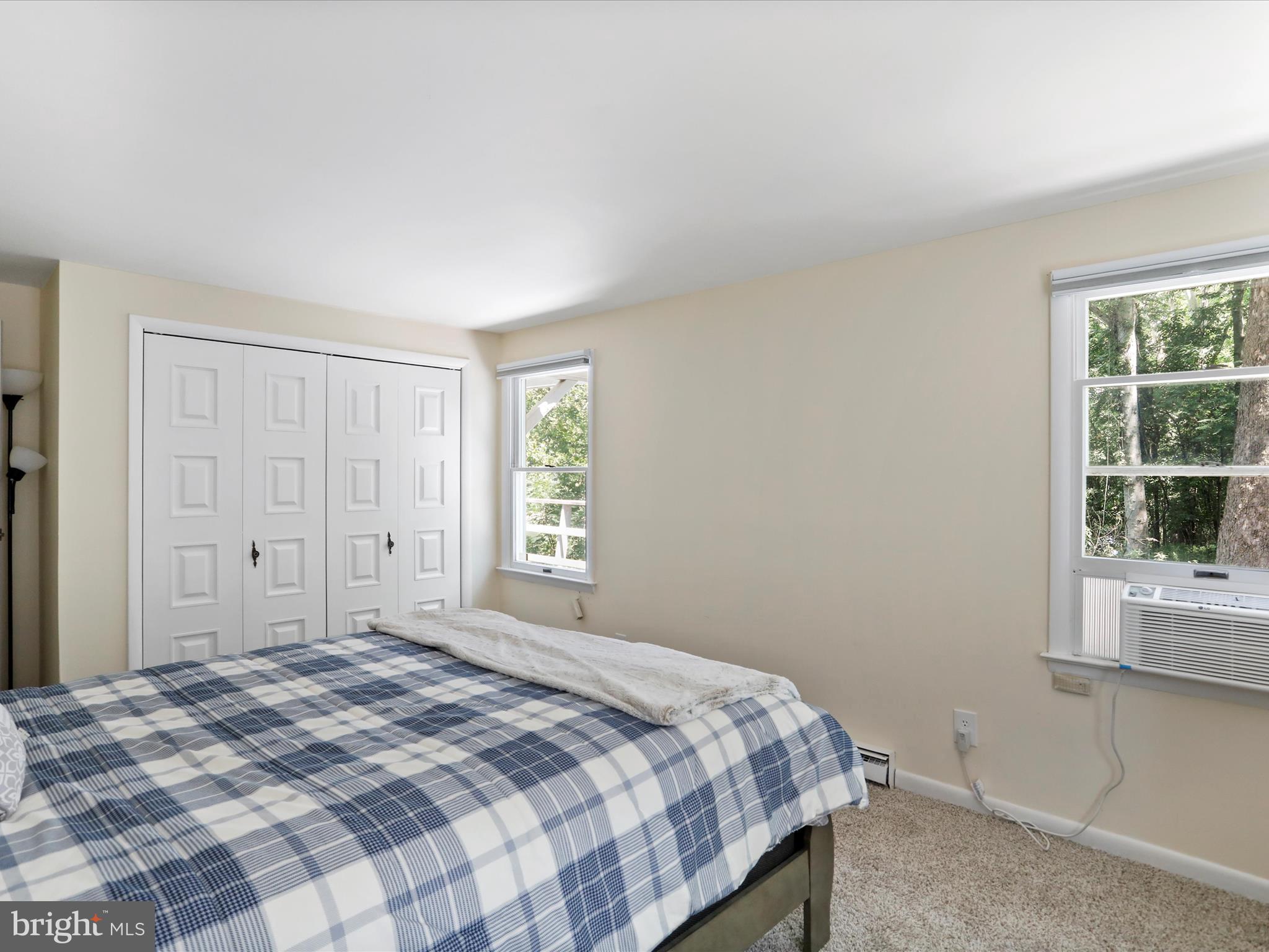 999 Aspero Lane Falling Waters, WV 25419 - Photo 39 of 57 a bedroom with a bed and a window