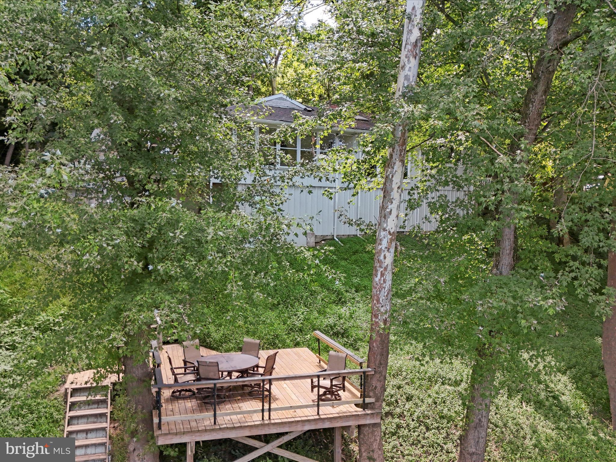 999 Aspero Lane Falling Waters, WV 25419 - Photo 53 of 57 a view of a chairs and table in the backyard