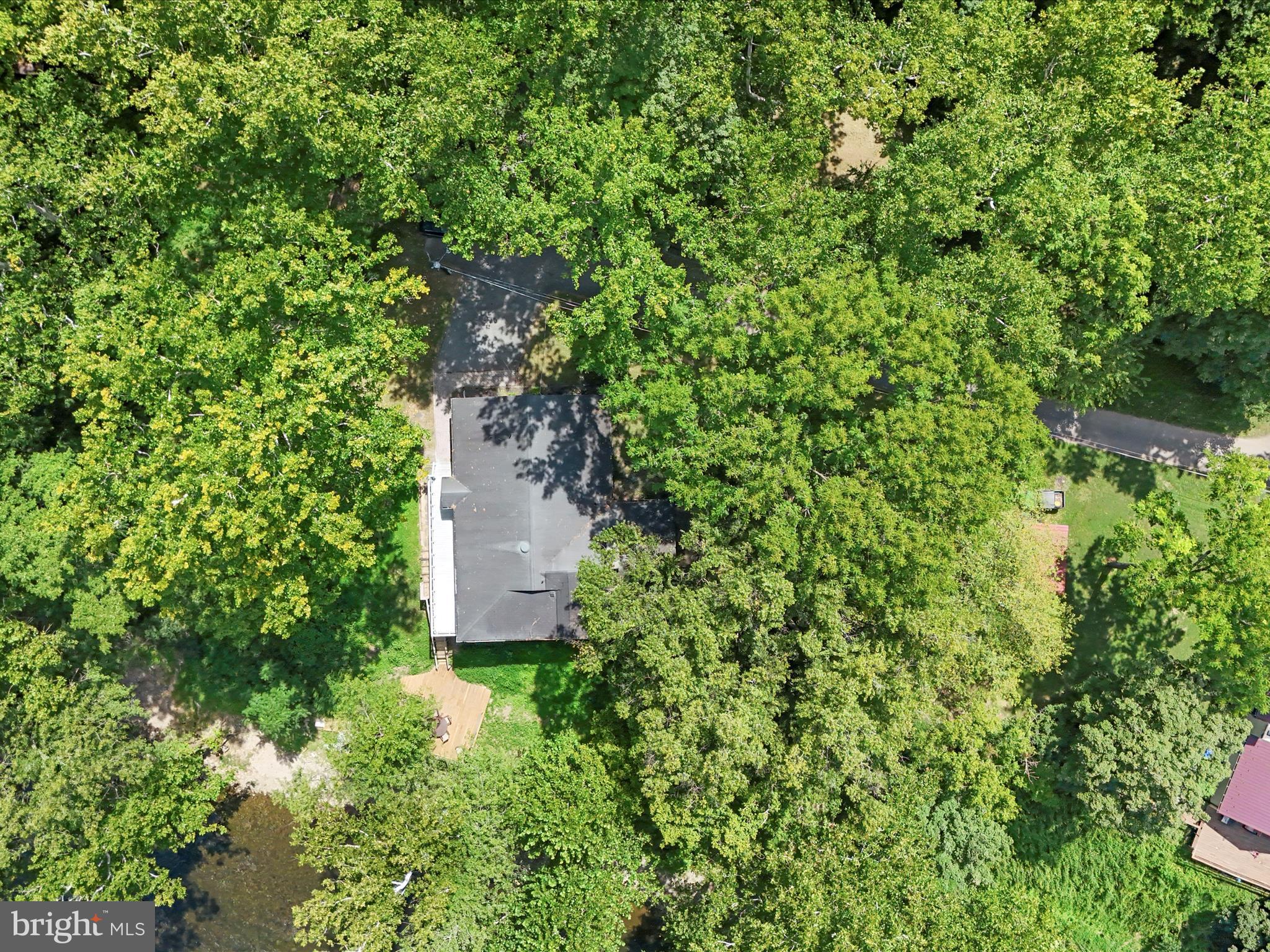 999 Aspero Lane Falling Waters, WV 25419 - Photo 57 of 57 an aerial view of residential house with outdoor space and trees all around