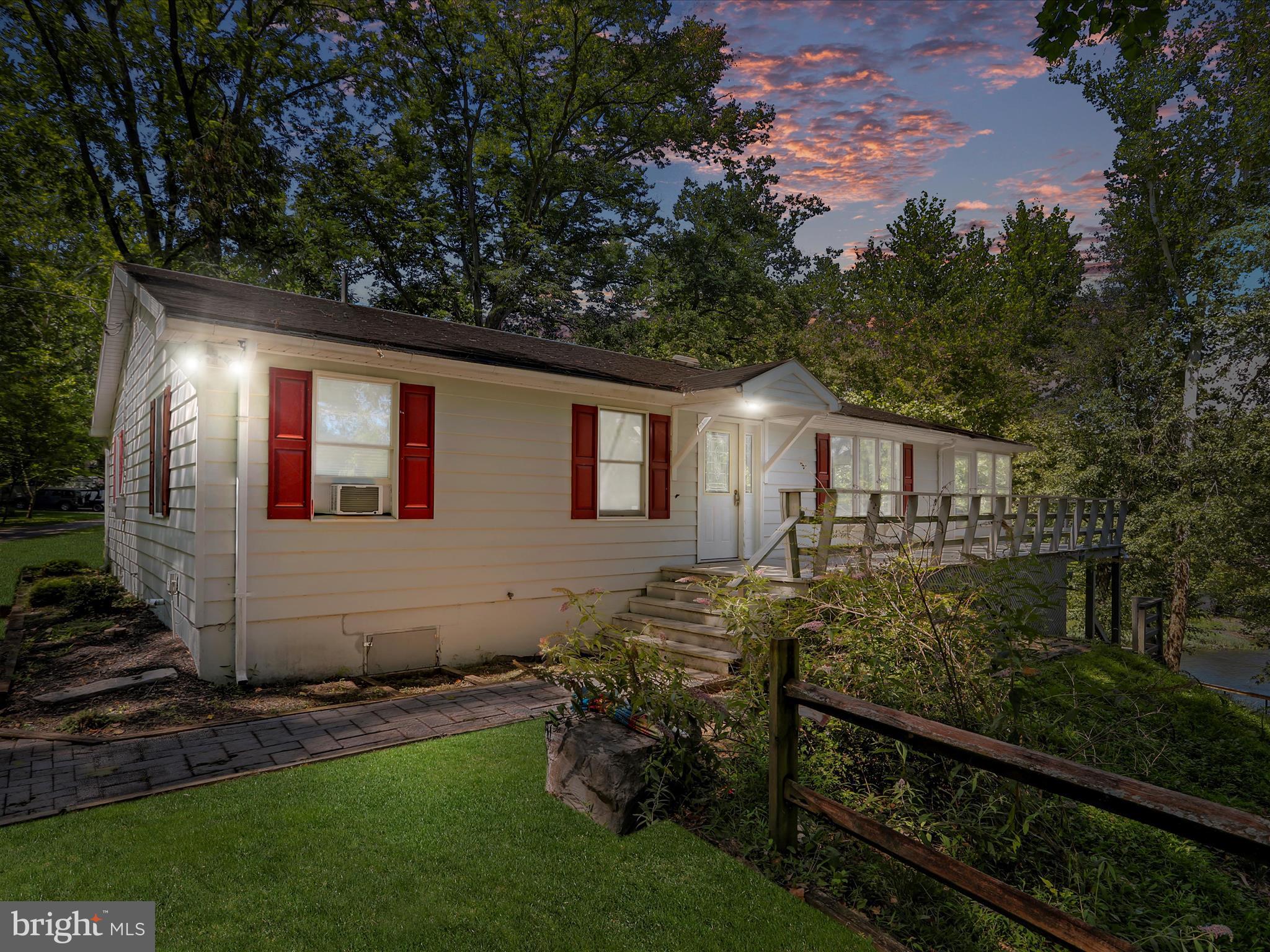 999 Aspero Lane Falling Waters, WV 25419 - Photo 6 of 57 a front view of a house with garden