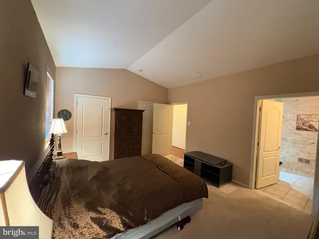 a bed room with a bed and a window