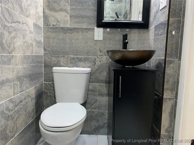 a bathroom with a toilet and a sink