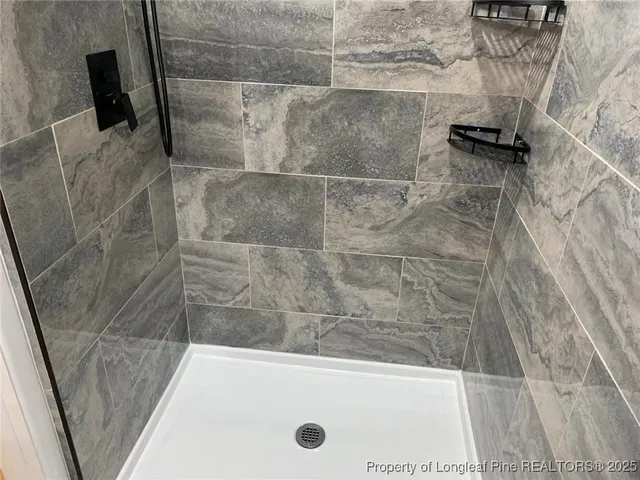 a bathroom with a bath tub