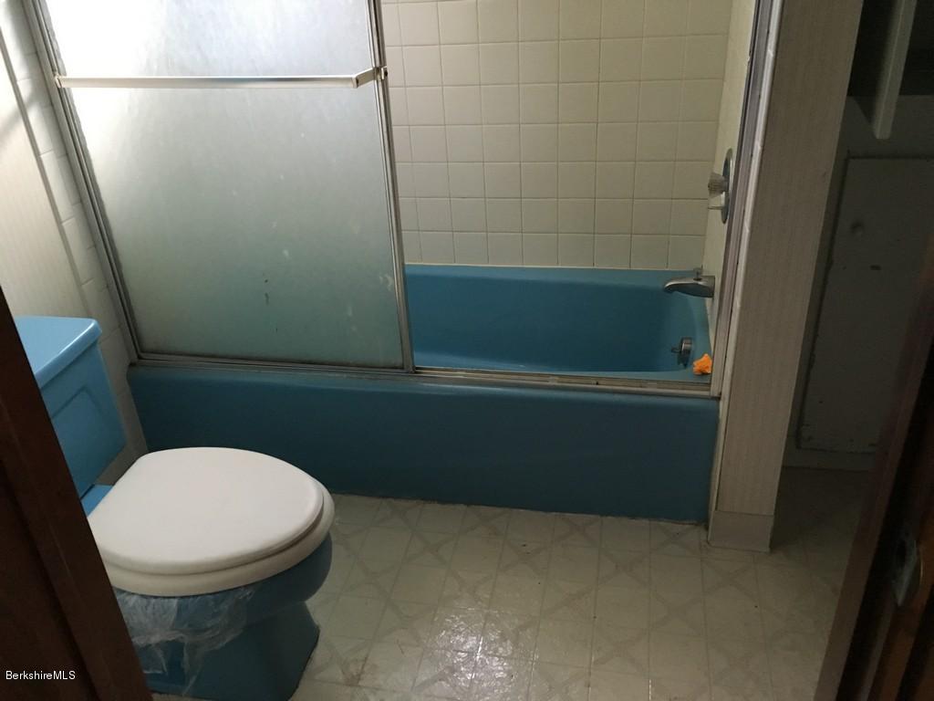 135 River Road Monroe, MA 01350 - Photo 7 of 21 a bathroom with a toilet and a shower