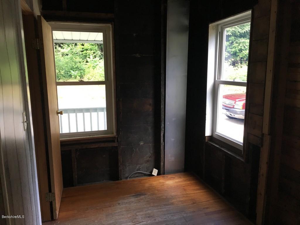 135 River Road Monroe, MA 01350 - Photo 10 of 21 a view of an empty room with a window