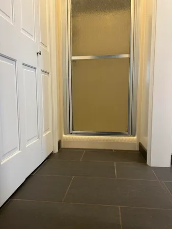 a view of a hallway with windows