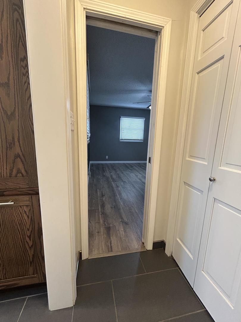 712 Kelley Drive Rochelle, IL 61068 - Photo 25 of 35 a view of a hallway with wooden floor and entryway