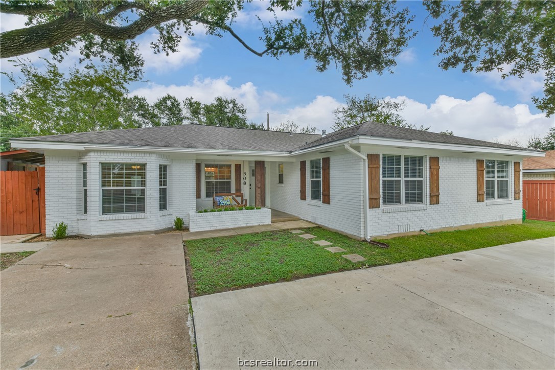 308 Laurel Street Bryan, TX 77801 - Photo 1 of 1 front view of a house with a garden