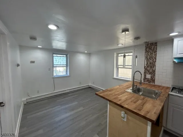a kitchen with sink and window