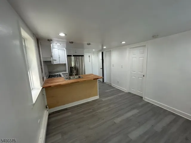 a view of kitchen with wooden floor