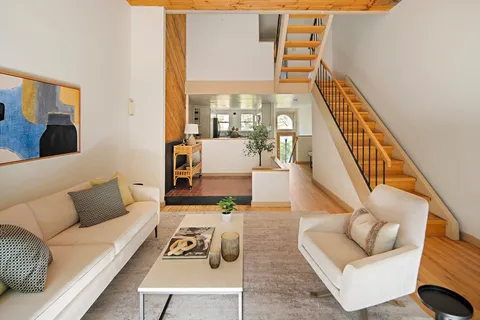 a living room with furniture and a table