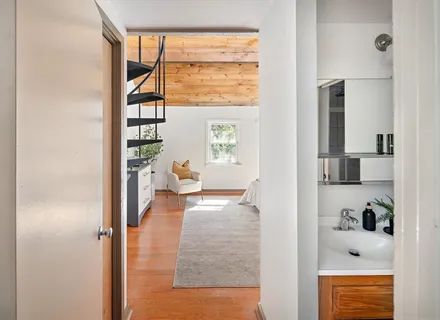 a view of living room with furniture and a window