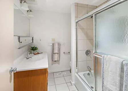 a bathroom with a bathtub and shower