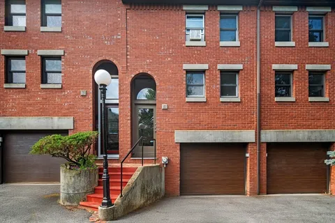 a front view of a building with street view