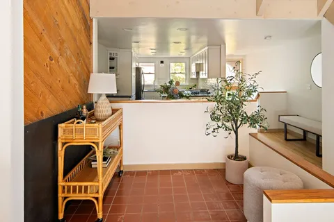 a view of a kitchen with furniture and a kitchen