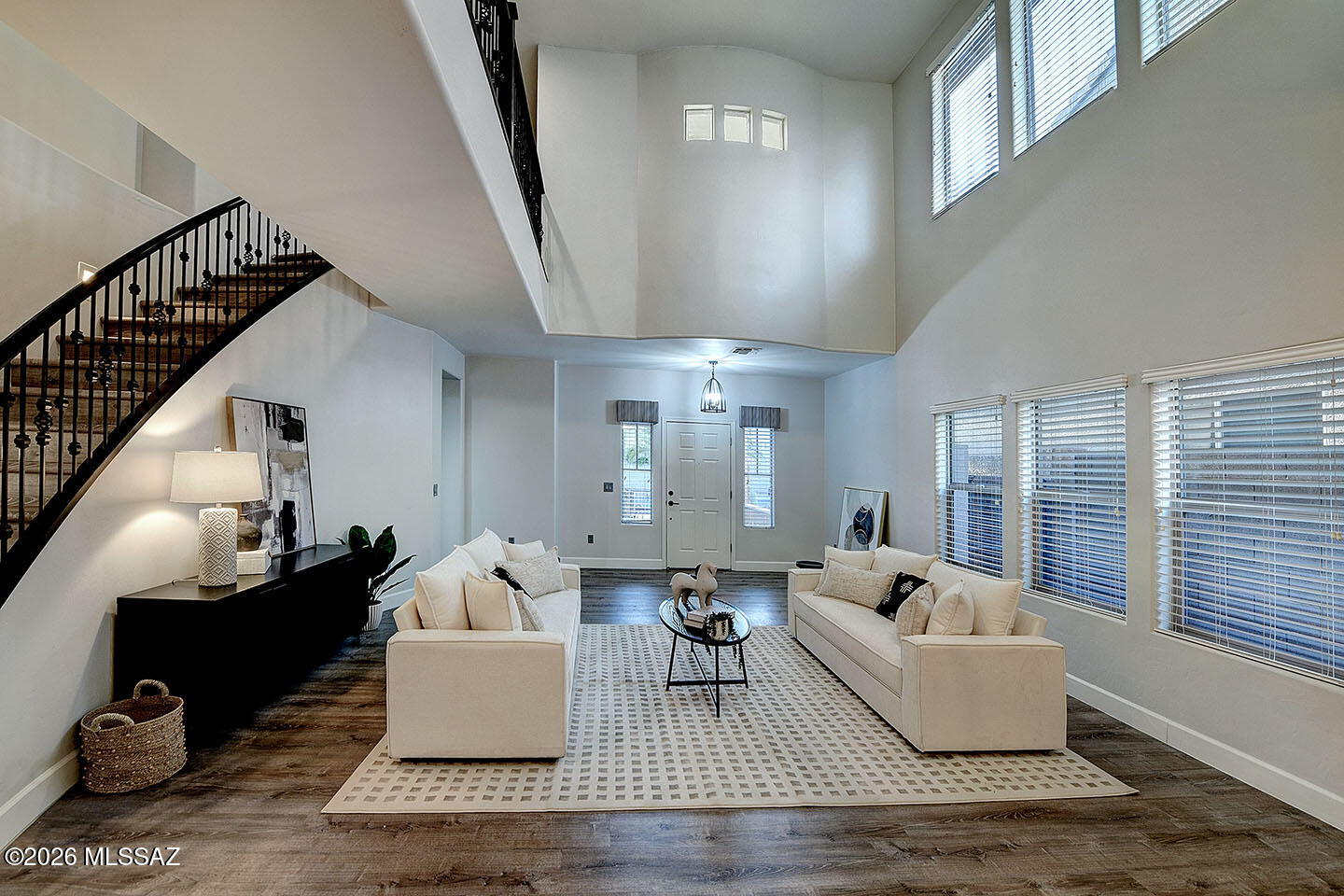 13464 North Piemonte Way Oro Valley, AZ 85755 - Photo 6 of 33 a living room with furniture and a large window