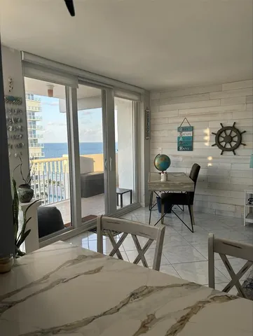 a view of balcony with furniture