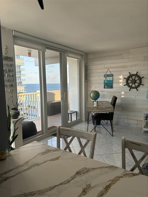 1370 South Ocean Boulevard, Unit 1005 Pompano Beach, FL 33062 - Photo 20 of 27 a view of a livingroom with workspace and a window