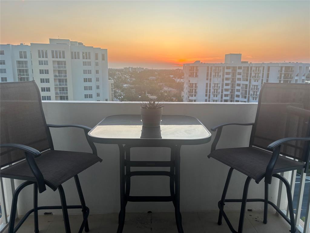 1370 South Ocean Boulevard, Unit 1005 Pompano Beach, FL 33062 - Photo 5 of 27 a view of a chairs and table in a balcony