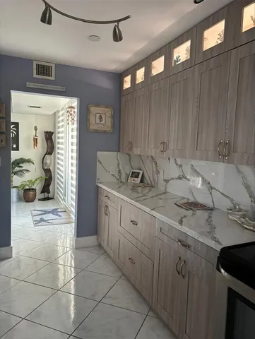 a room with cabinets and flat screen tv