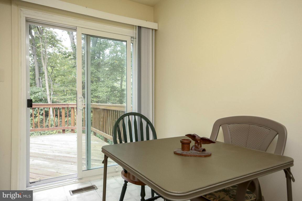 Eat in kitchen w/ SGD to deck overlooking trees