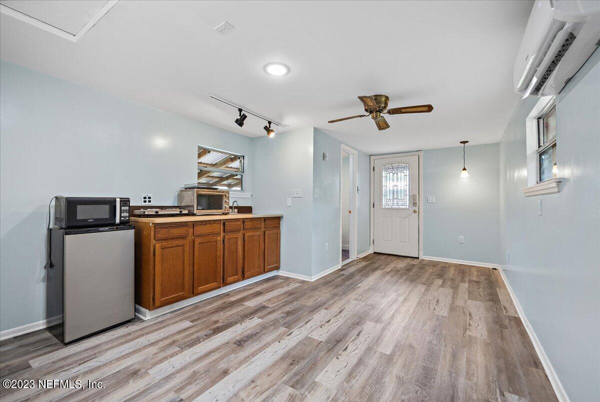 9006 Marlee Road Jacksonville, FL 32222 - Photo 16 of 18 a view of kitchen with sink microwave and cabinets