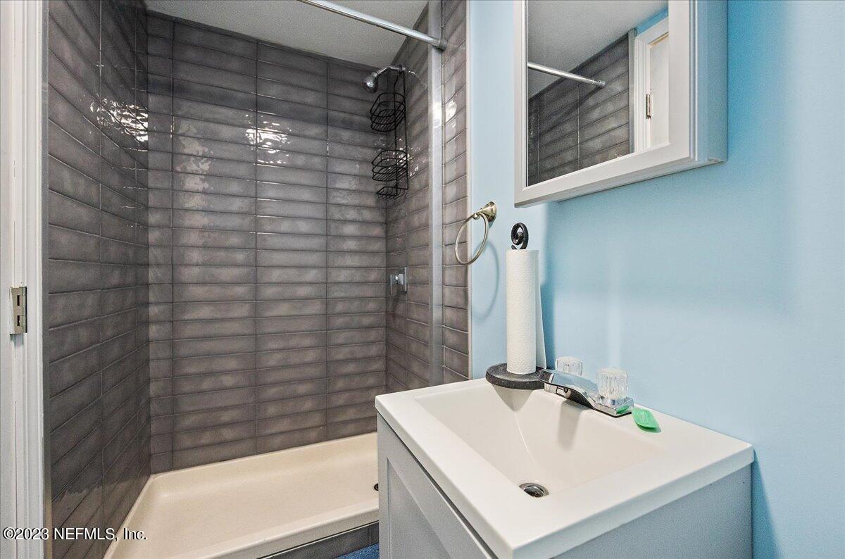 9006 Marlee Road Jacksonville, FL 32222 - Photo 17 of 18 a bathroom with a sink a toilet and shower