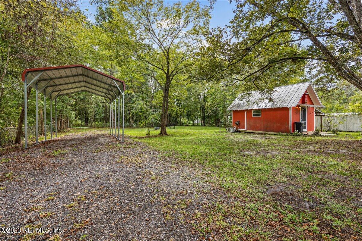 9006 Marlee Road Jacksonville, FL 32222 - Photo 18 of 18 a view of a house with a backyard