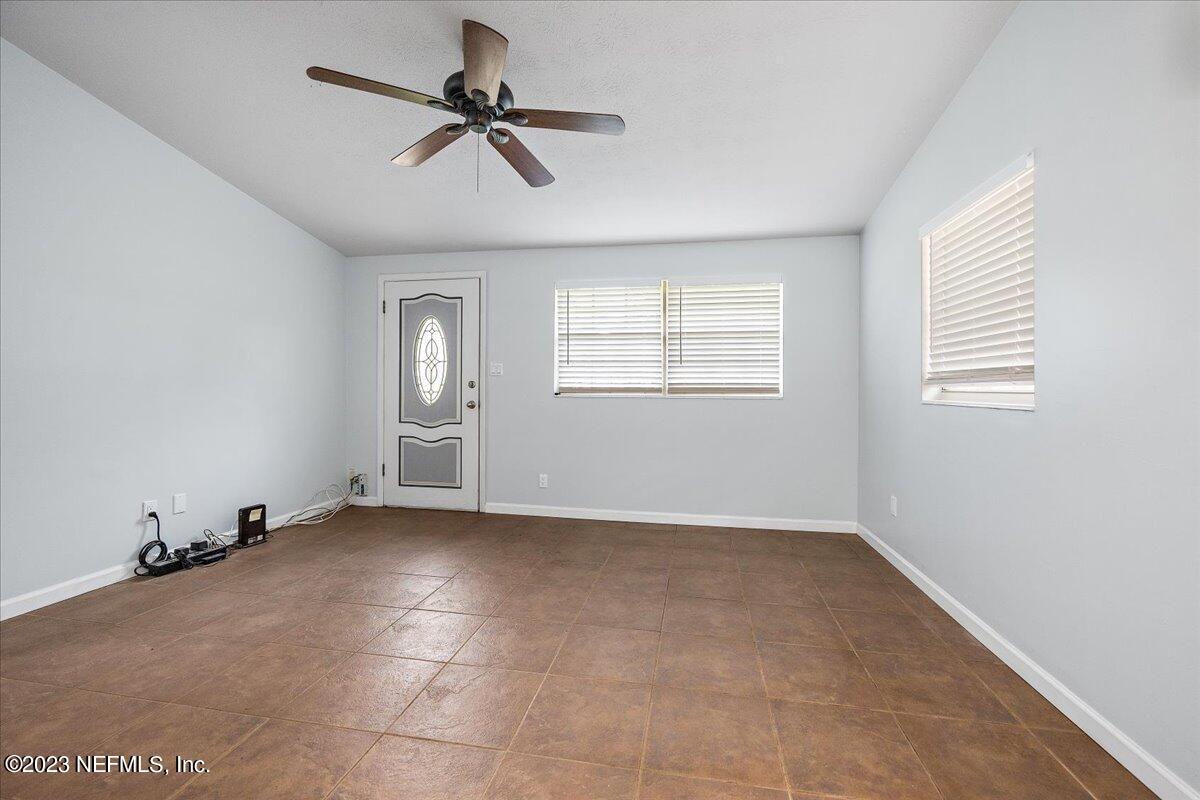 9006 Marlee Road Jacksonville, FL 32222 - Photo 5 of 18 a view of an empty room with a window