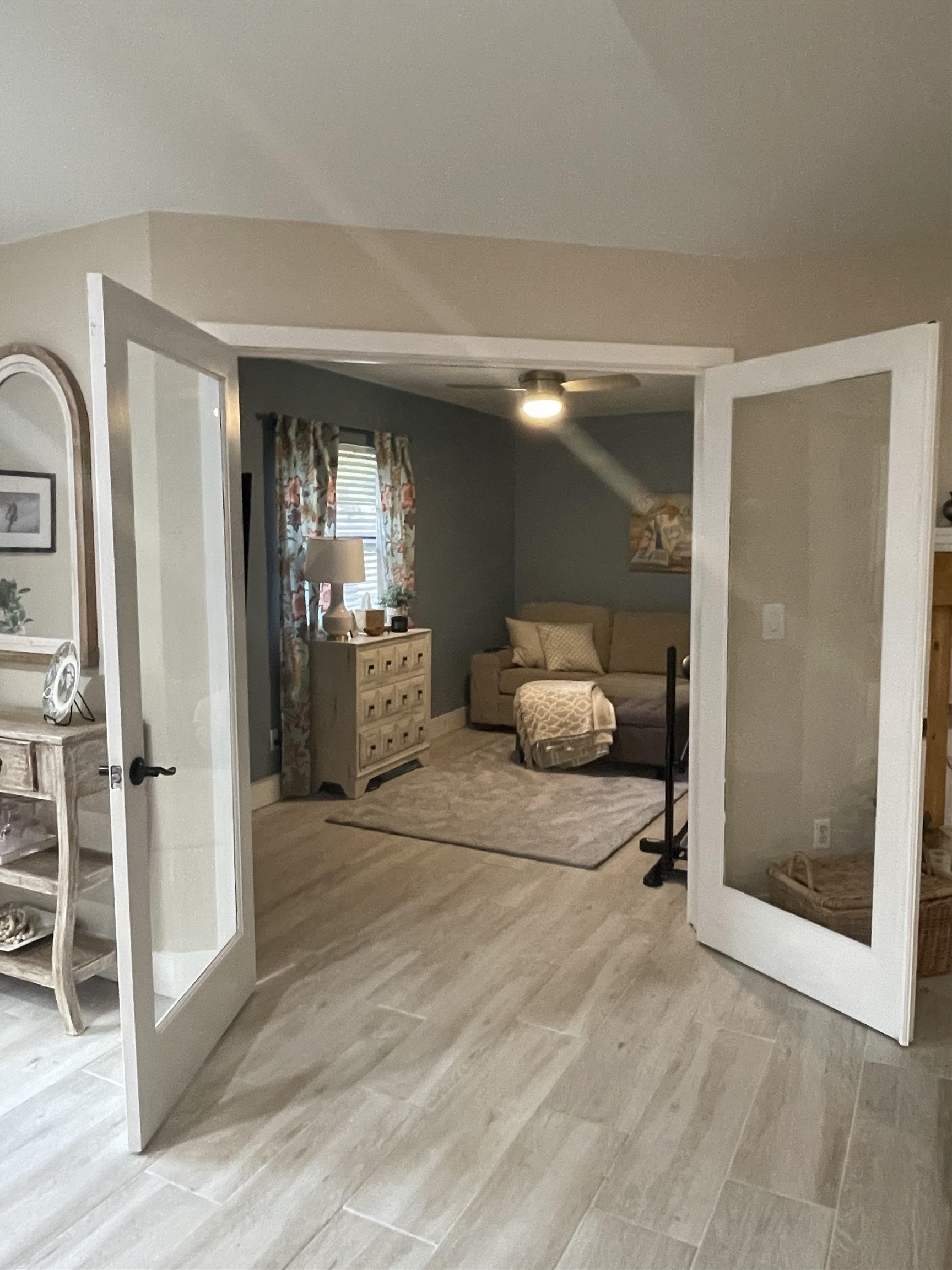 147 Swallow Road St. Augustine, FL 32086 - Photo 12 of 26 a view of a hallway with wooden floor and livingroom with furniture