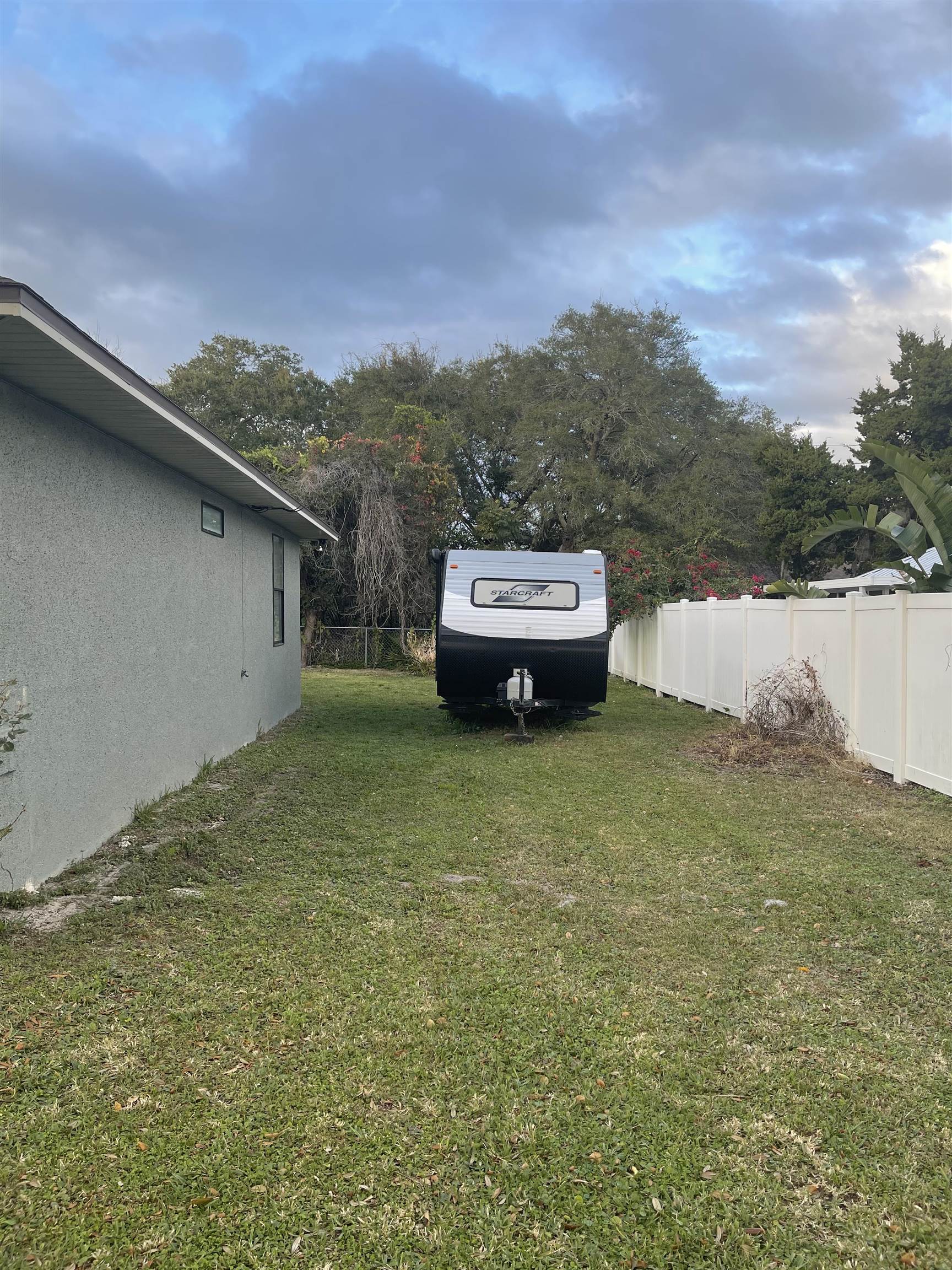147 Swallow Road St. Augustine, FL 32086 - Photo 20 of 26 a view of a big yard with an outdoor seating
