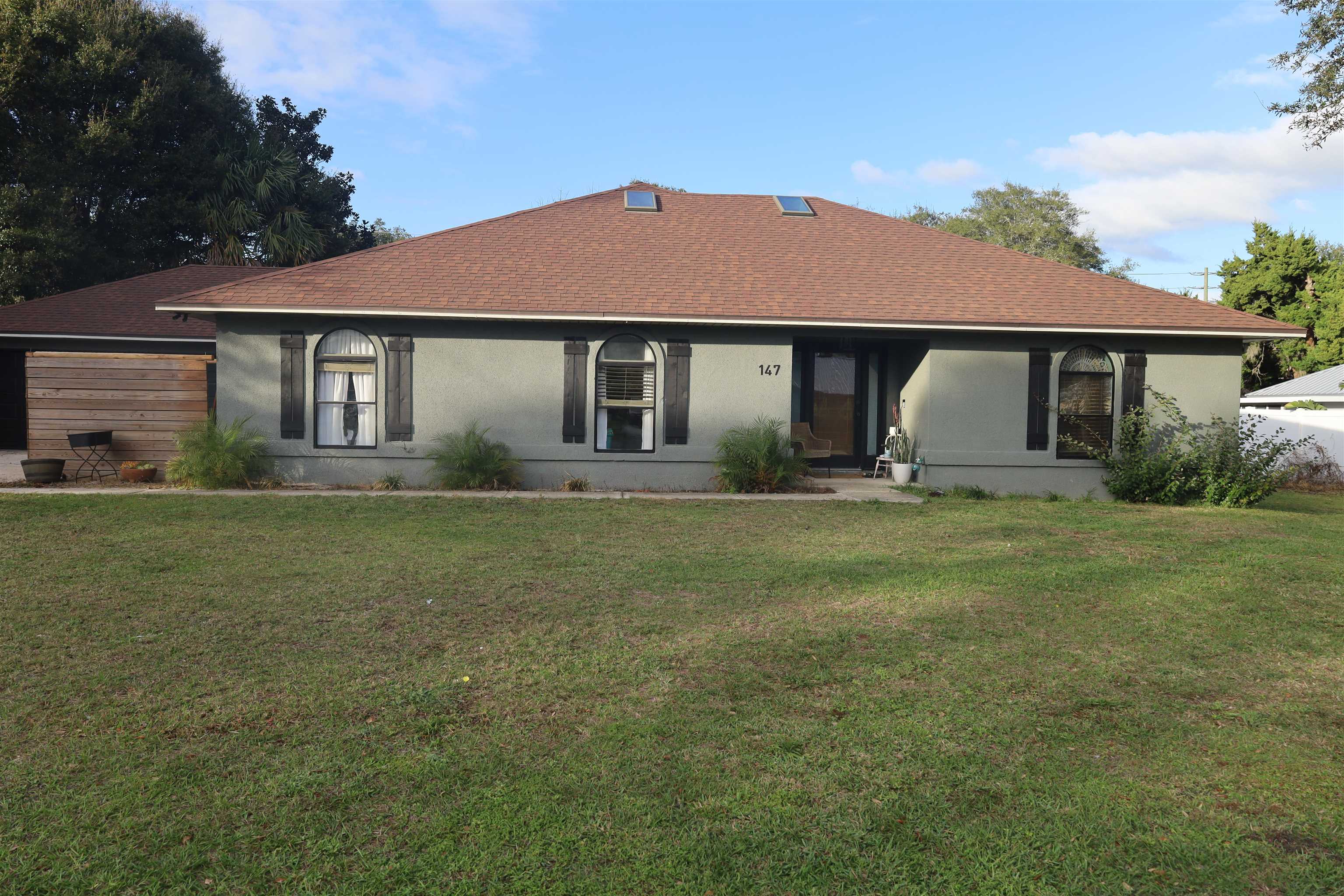 147 Swallow Road St. Augustine, FL 32086 - Photo 2 of 26 a front view of house with yard and green space