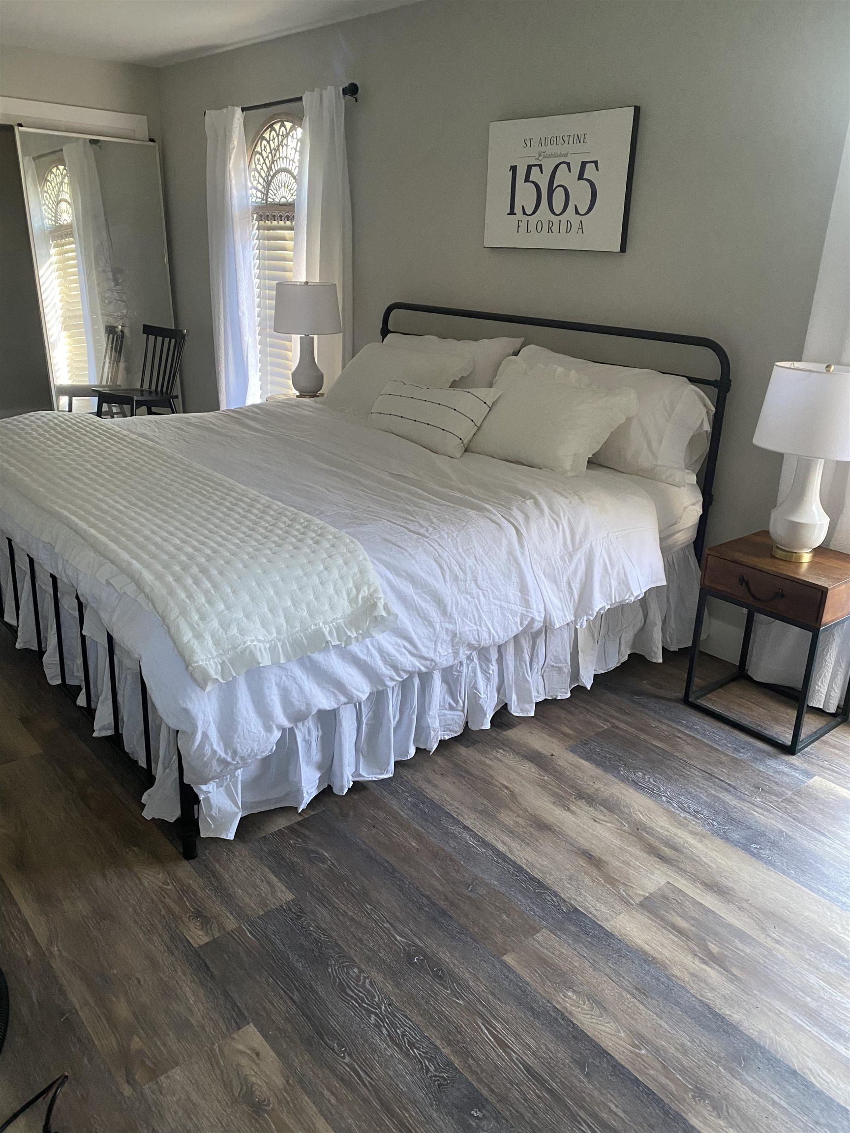 147 Swallow Road St. Augustine, FL 32086 - Photo 21 of 26 a spacious bedroom with a bed table and a window