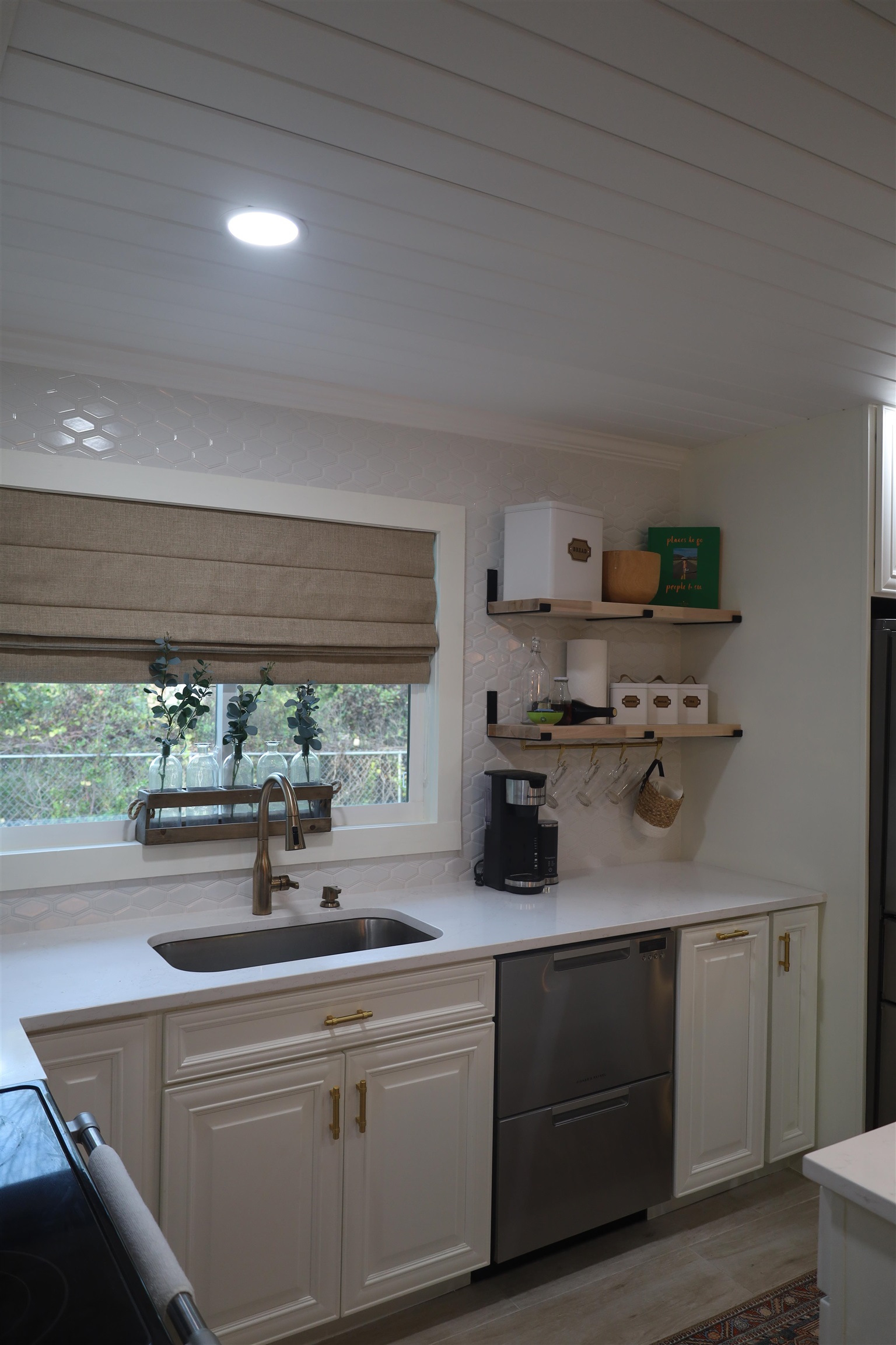 147 Swallow Road St. Augustine, FL 32086 - Photo 7 of 26 a kitchen with a sink and large window