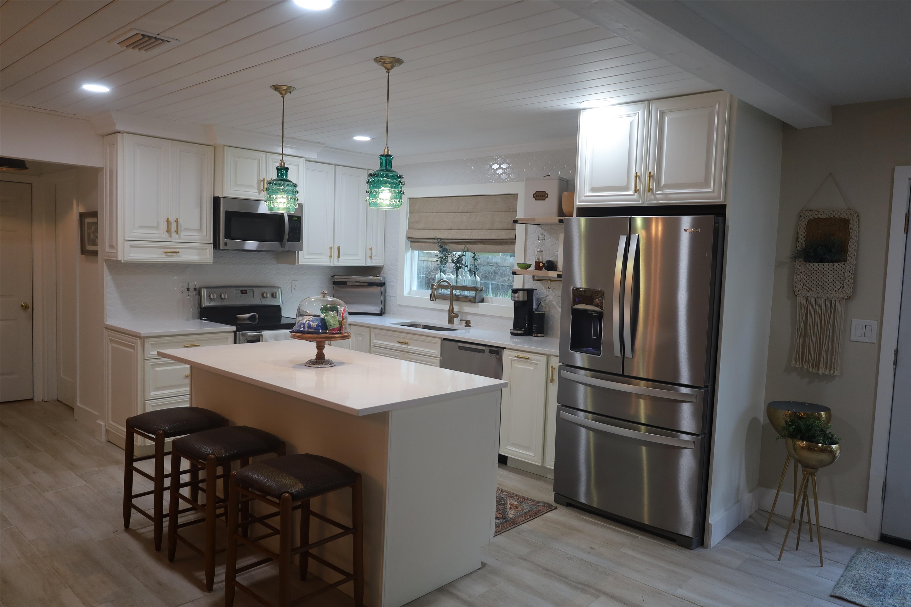 147 Swallow Road St. Augustine, FL 32086 - Photo 8 of 26 a kitchen with a sink stainless steel appliances and refrigerator