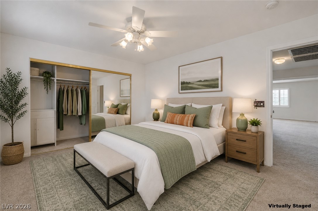 1479 Orange Jubilee Road Henderson, NV 89014 - Photo 25 of 36 Ample closet space complements this cozy bedroom, creating a tranquil retreat for rest and rejuvenation.