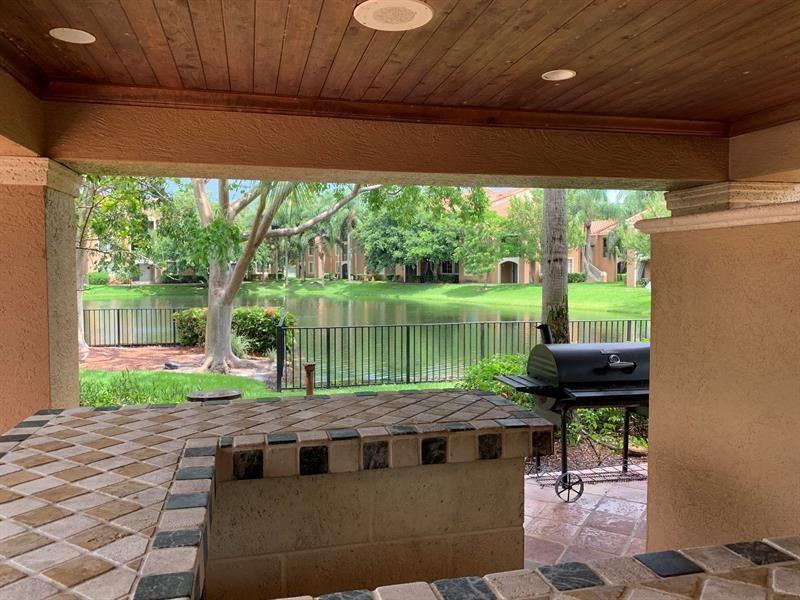 4816 Highway 7, Unit 11203 Coconut Creek, FL 33073 - Photo 13 of 35 a view of a back yard