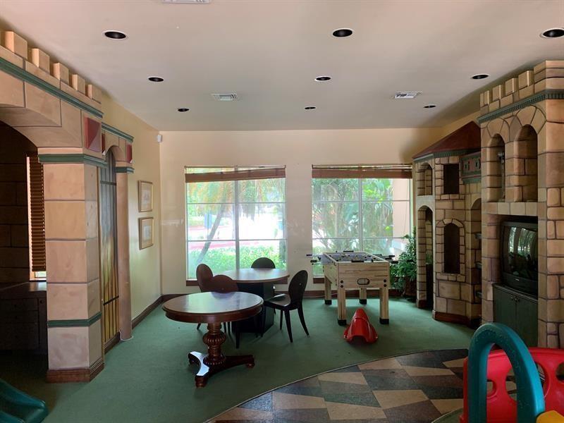 4816 Highway 7, Unit 11203 Coconut Creek, FL 33073 - Photo 15 of 35 a living room with furniture and a large window