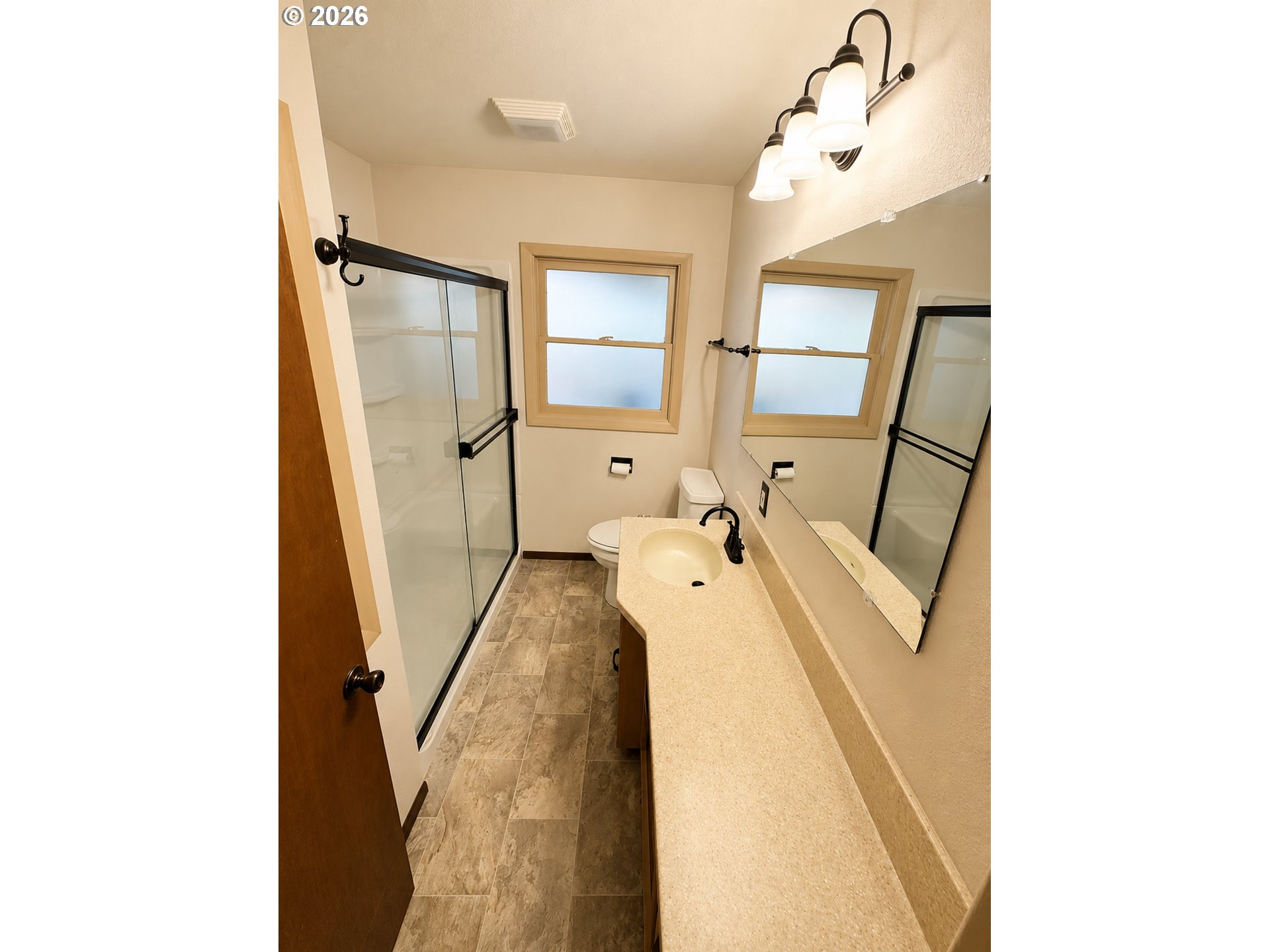 10 Southwest Peach Lane Winston, OR 97496 - Photo 9 of 22 a en suite bathroom with a sink a mirror and vanity