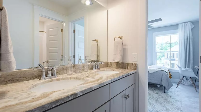 710 Conifer Dr Spring Hill Spring Hill, TN 37174 - Photo 18 of 22 a bathroom with a granite countertop sink and a mirror