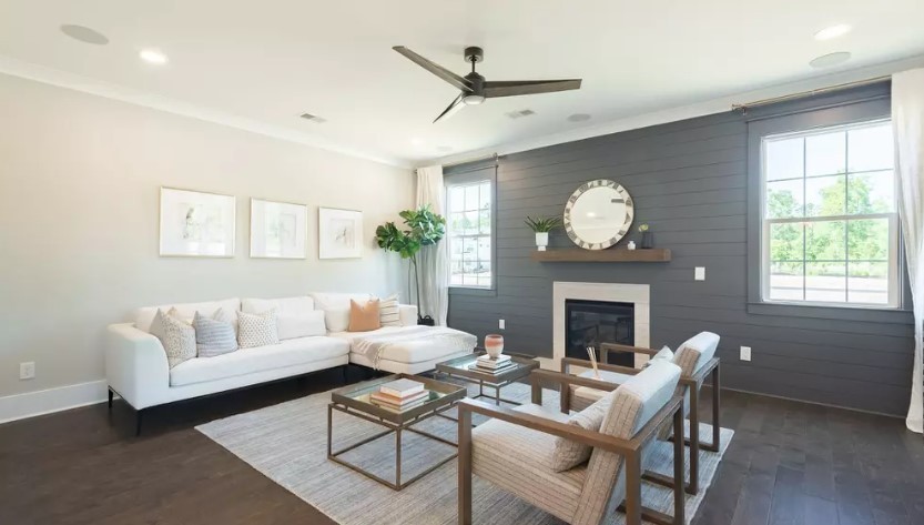 710 Conifer Dr Spring Hill Spring Hill, TN 37174 - Photo 10 of 22 a living room with furniture a fireplace and a large window