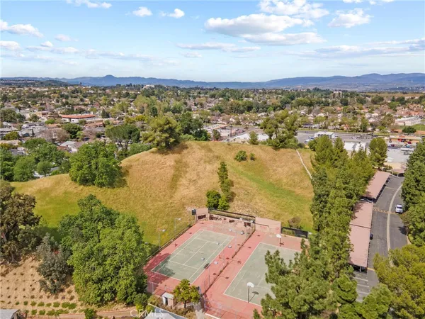 an aerial view of residential houses with outdoor space