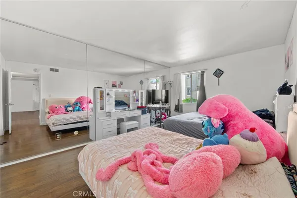 a bedroom with bed and a couch