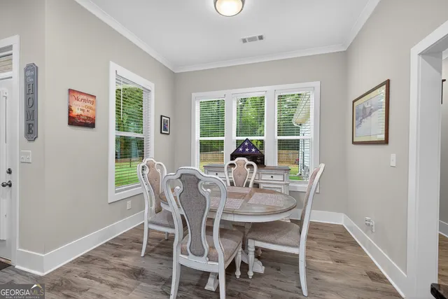 a bathroom with a sink mirror and toilet