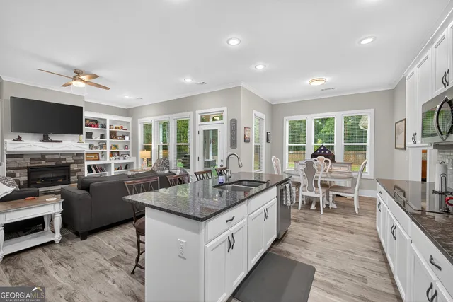 a view of a house with a backyard porch and sitting area