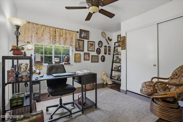 a workspace with furniture and a window